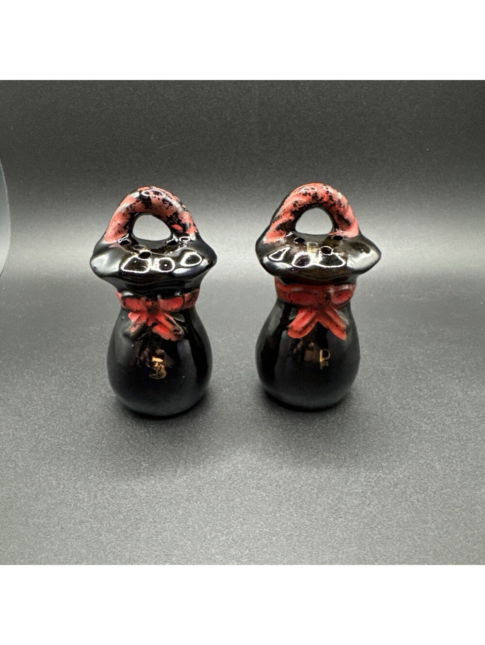Vintage Black Ceramic Sack Salt and Pepper Shakers Red Bow Handled Set